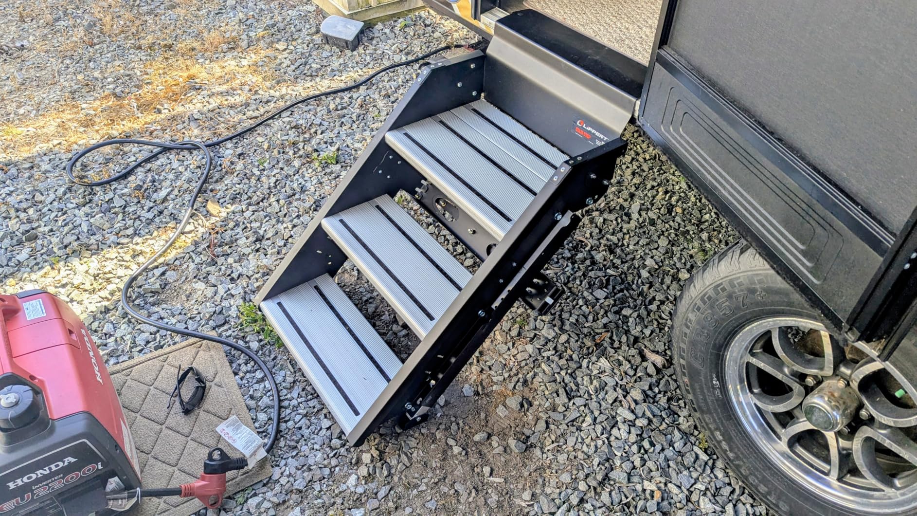Lippert Components - 791572 Solid Step Triple Step for RV and Travel Trailer Entry Doorway Black 26-inch | Extra-wide top tread with aluminum treads, adjustable legs for uneven ground, folds into doorway, hardware included customer photo 2