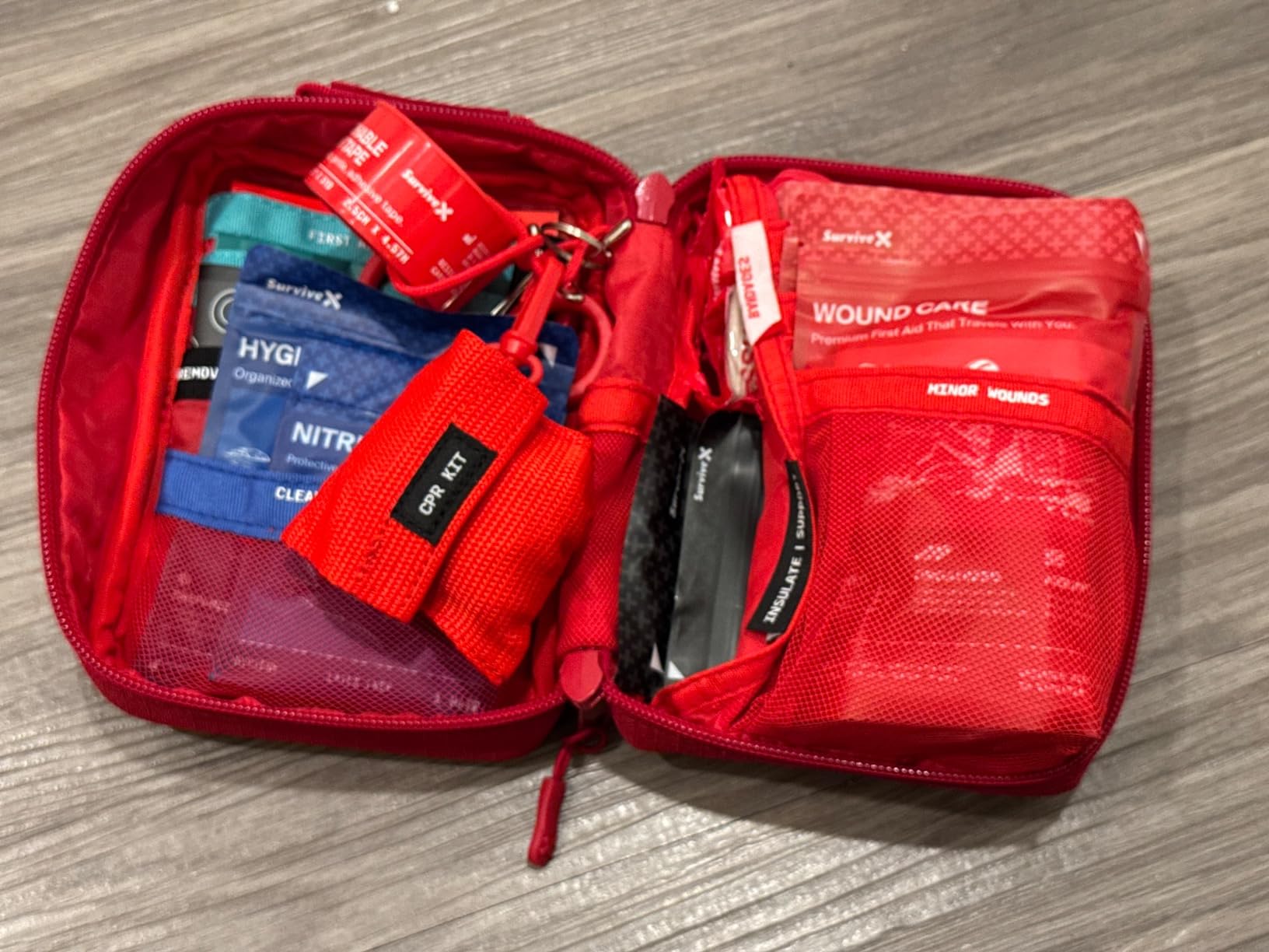 SurviveX Small First Aid Kit, Zip Stitch Wound Closures, Labeled Pockets | Compact emergency kit for 2-3 people, mounts to anything, organized first aid for car, home, travel, camping, outdoors customer photo 2