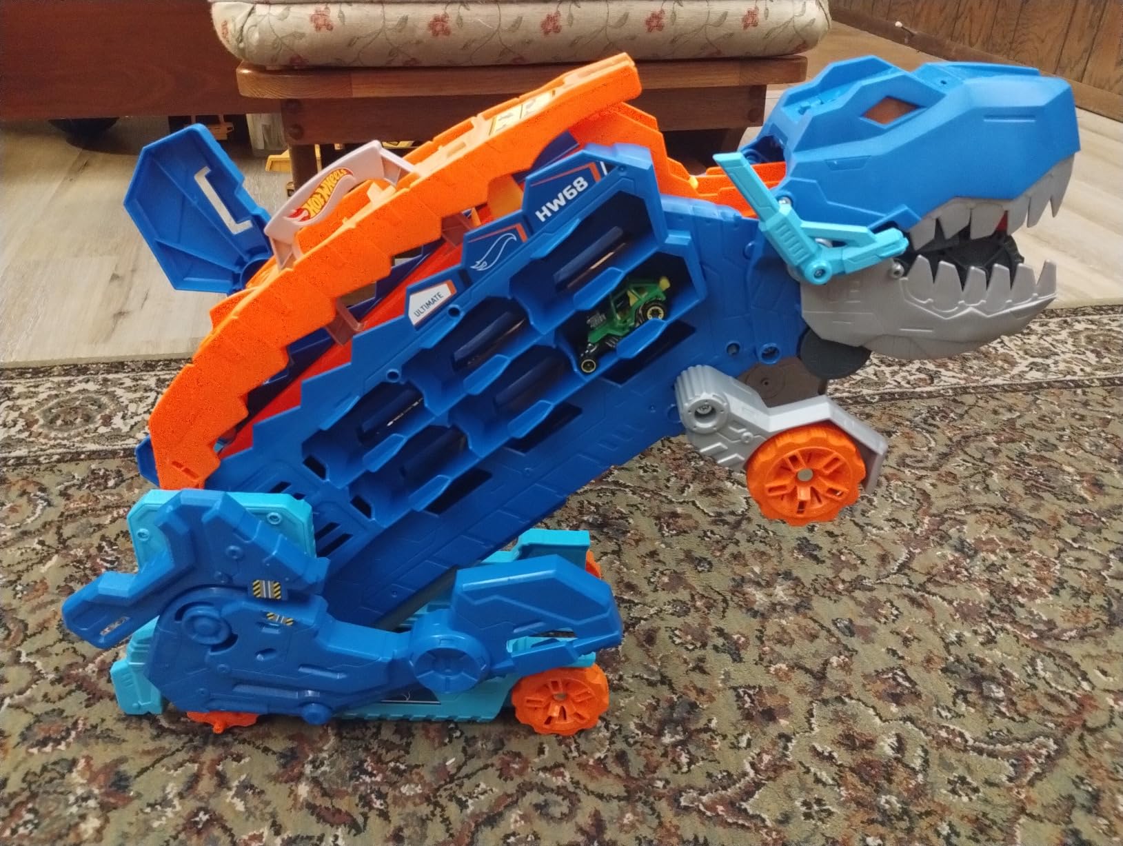 Hot Wheels City Toy Car Track Set, Ultimate T-Rex Transporter, Hauler Transforms into Stomping Dino with Race Track, from Netflix Series “Let’s Race” customer photo 1
